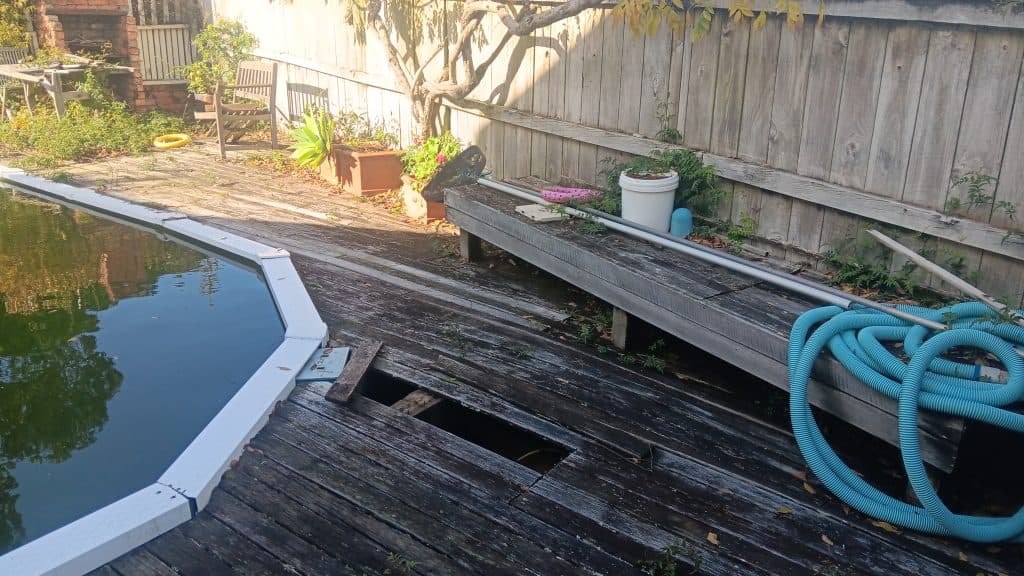 Pool deck damage and rotted timber boards